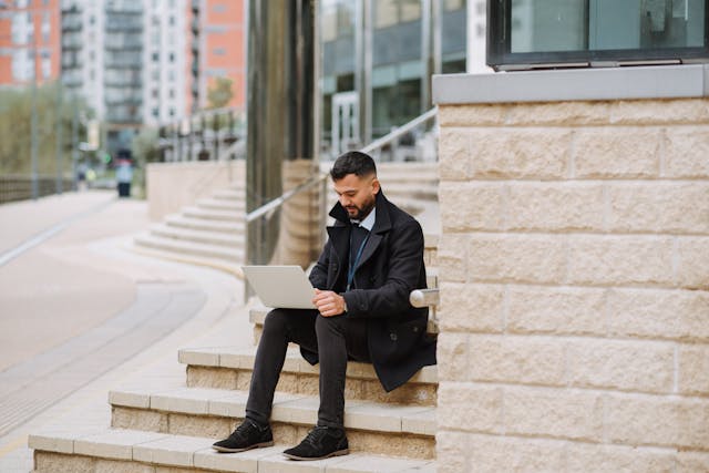Advisor carrying client portfolio documents in a private office