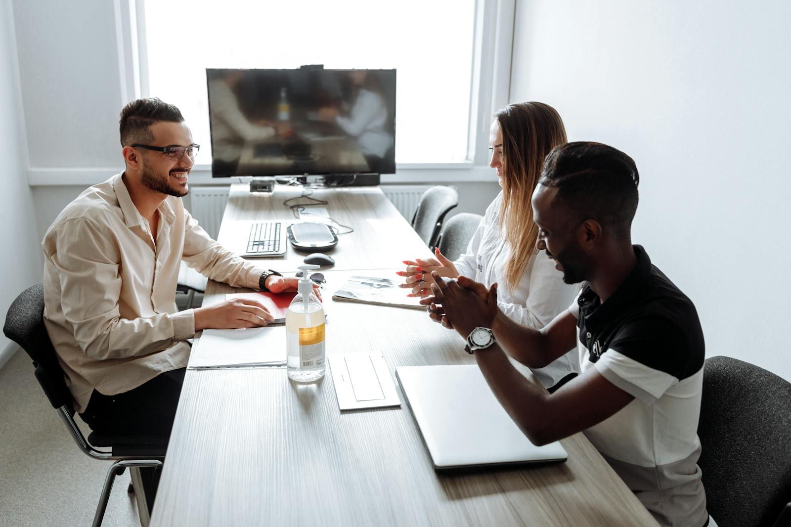 Leadership team gathered around a boardroom table for an investment committee discussion