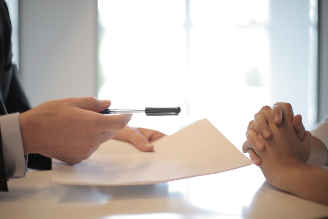 Private wealth advisor reviewing portfolio materials with a client